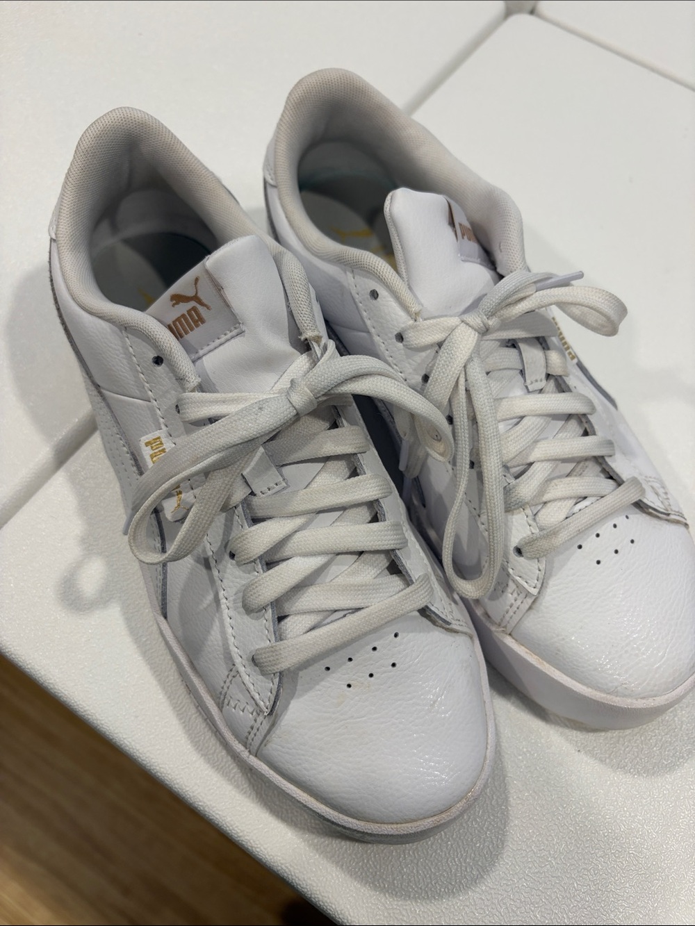 Puma White Leather Sneakers with Gold Branding